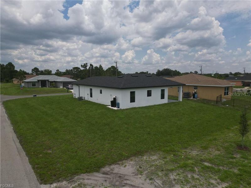 Front exterior of a new home in , Lehigh Acres, FL, highlighting curb appeal (Image 1).
