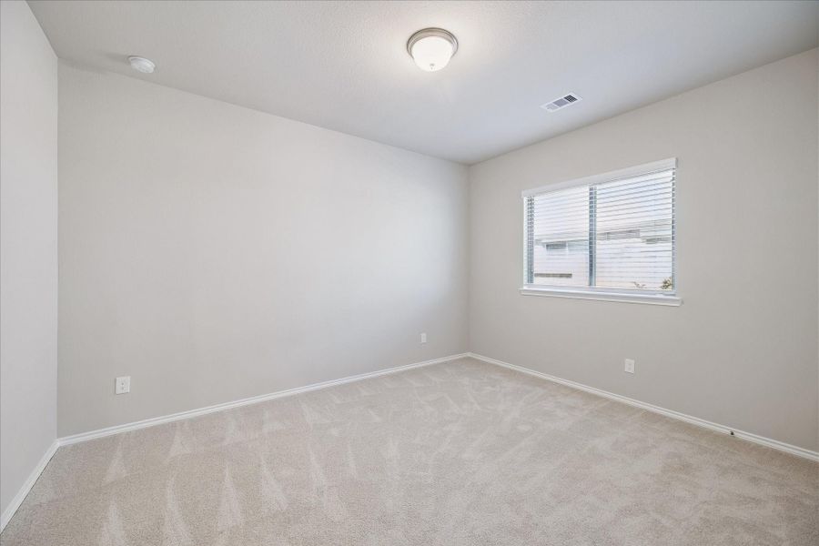 Bedroom 2 is on the other side of the bathroom. All the rooms have plenty of natural light and closet space.