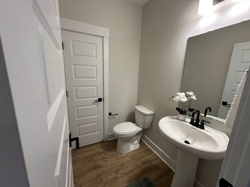 This clean and functional bathroom features a clas
