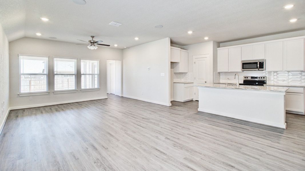Representative furnished interior of a home built from the Paramount by Brightland Homes in Sunterra, Katy (Image 7).