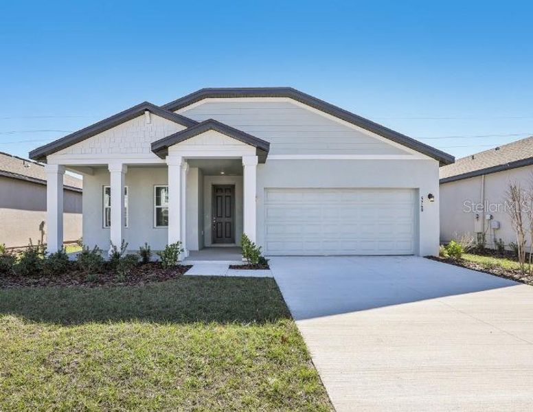 Front exterior of a new home in Sunbrooke, St. Cloud, FL, highlighting curb appeal (Image 22). Front exterior of a new home in Sunbrooke, St. Cloud, FL, highlighting curb appeal (Image 22).