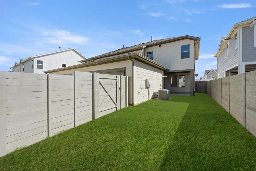 Exterior details and patio area of a home in The Retreat at Harvest, Argyle (Image 4).