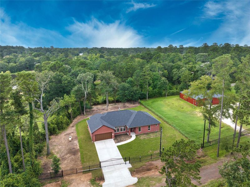 Front exterior of a new home in , Plantersville, TX, highlighting curb appeal (Image 2). Front exterior of a new home in , Plantersville, TX, highlighting curb appeal (Image 2).