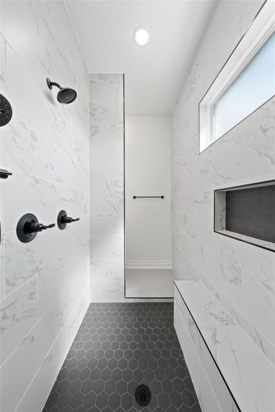 Full bath with tiled shower, tile walls, and recessed lighting Full bath with tiled shower, tile walls, and recessed lighting