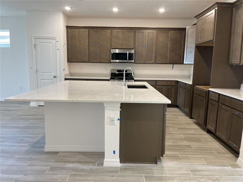 Furnished interior view inside a new home in Highfield at Twisted Oaks, Wildwood (Image 3).
