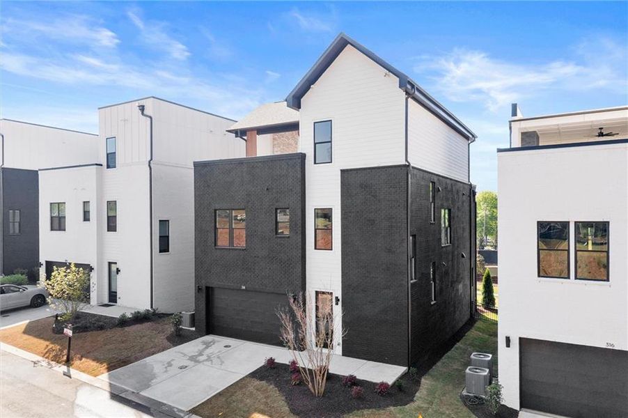 Front exterior of a new home in The Gathering – Alpharetta, Alpharetta, GA, highlighting curb appeal (Image 28).