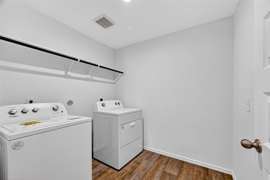 OVERSIZED LAUNDRY ROOM THAT INCLUDES THE WASHER AND DRYER