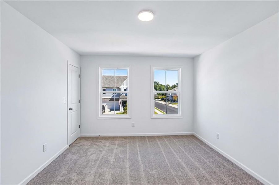 Spacious, unfurnished interior of a new home in Eastlyn Crossing, Flowery Branch (Image 15).