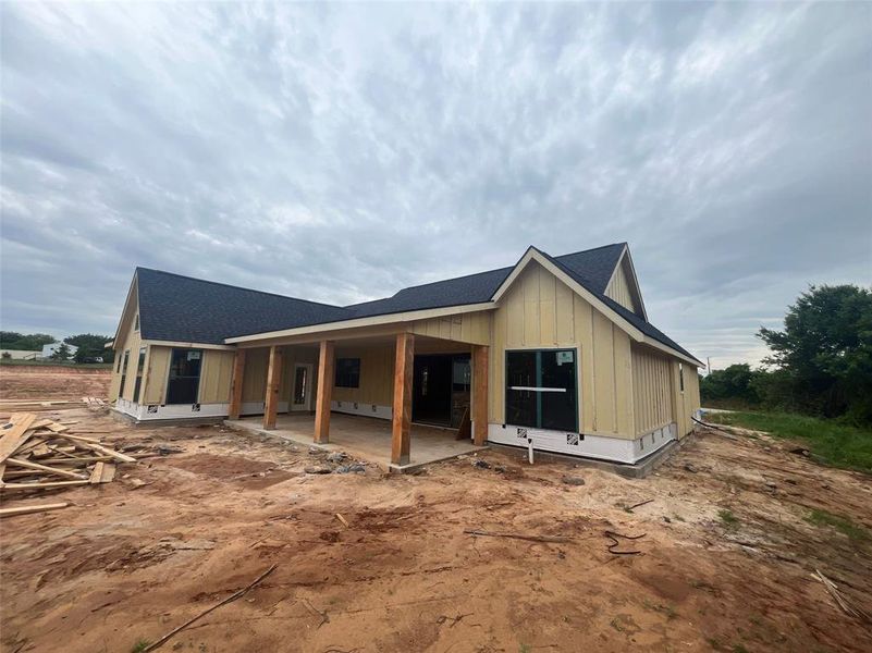Newly constructed single-story residence with board-and-batten style siding