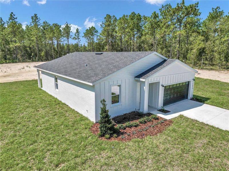 Front exterior of a new home in , Dunnellon, FL, highlighting curb appeal (Image 1).
