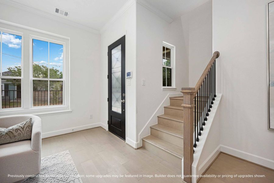 Your “wow” moment starts right here. Between the natural light, iron railings, and warm wood treads, the vibe is polished—but still totally livable. Your “wow” moment starts right here. Between the natural light, iron railings, and warm wood treads, the vibe is polished—but still totally livable.