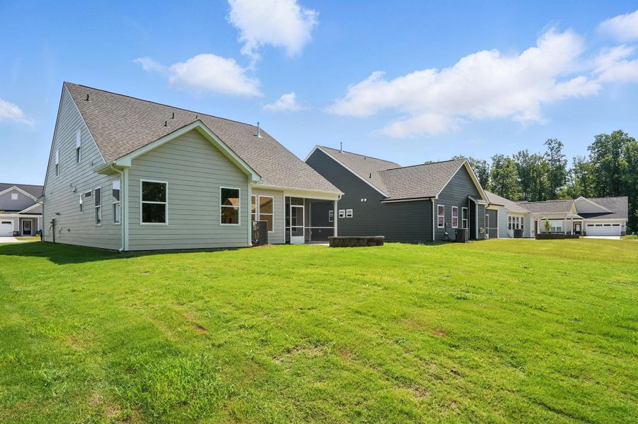 Front exterior of a new home in Heritage - 55+ Community, Wesley Chapel, NC, highlighting curb appeal (Image 22).