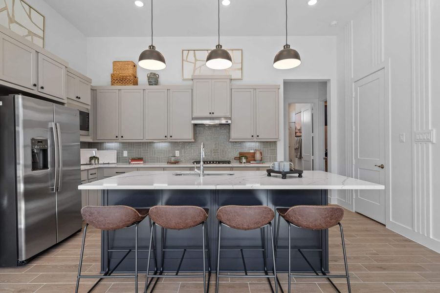 Representative furnished interior of a home built from the Bonneville by Chesmar Homes in University Heights, Round Rock (Image 6).