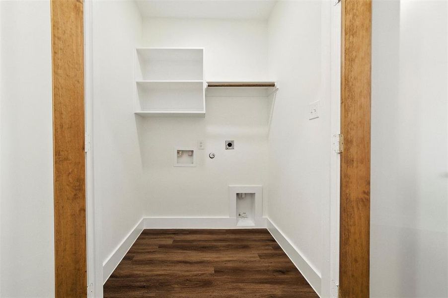 Laundry room with hookup for an electric dryer, hookup for a gas dryer, dark wood-style floors, and hookup for a washing machine