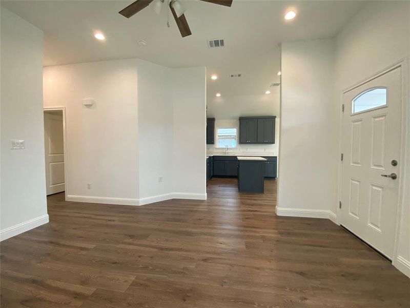 Featuring recessed lighting, dark wood-style flooring, and ceiling fan Featuring recessed lighting, dark wood-style flooring, and ceiling fan