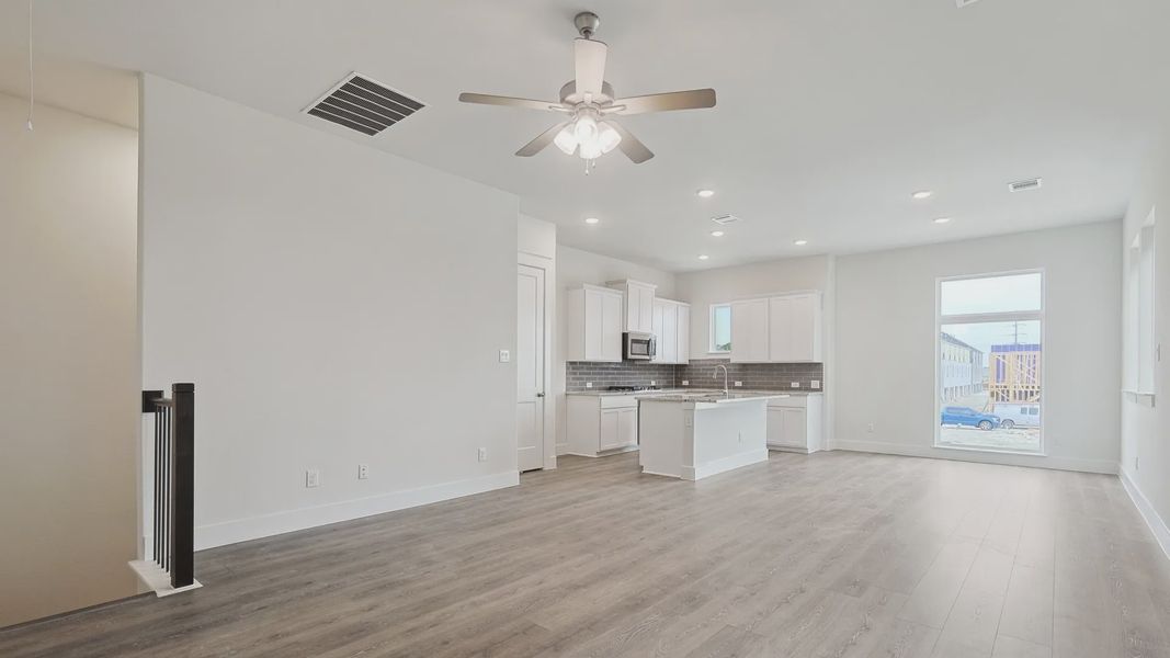 Furnished interior view inside a new home in Collin Creek, Plano (Image 4).