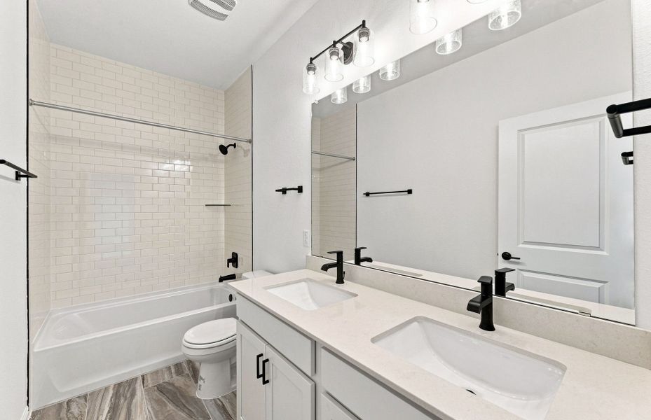Furnished interior view inside a new home in Bluffview Reserve, Leander (Image 9).