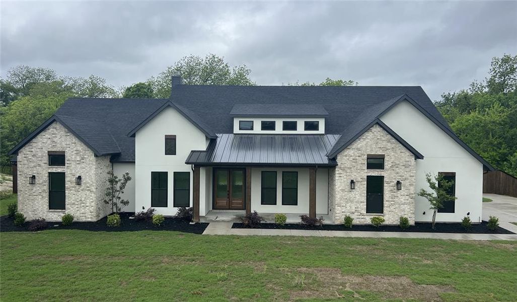 Front exterior of a new home in , Midlothian, TX, highlighting curb appeal (Image 1). Front exterior of a new home in , Midlothian, TX, highlighting curb appeal (Image 1).