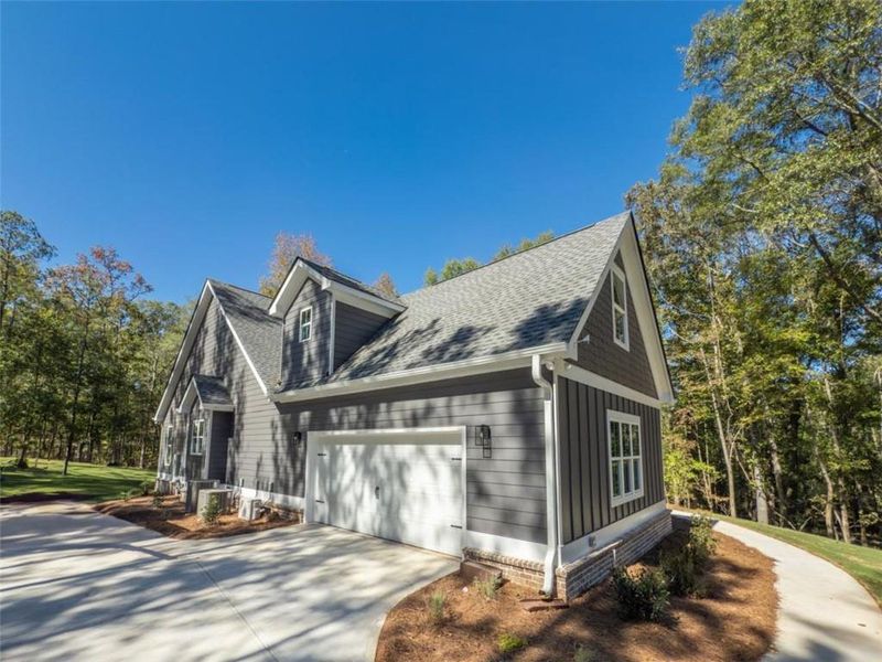 Front exterior of a new home in , Monroe, GA, highlighting curb appeal (Image 28). Front exterior of a new home in , Monroe, GA, highlighting curb appeal (Image 28).