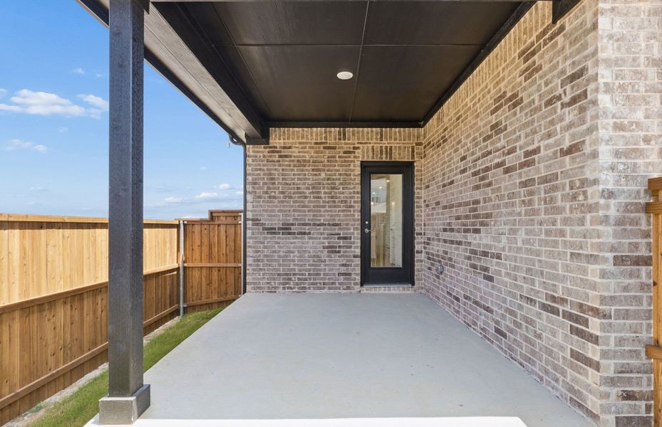 Exterior details and patio area of a home in Pinnacle at Legacy Hills, Celina (Image 2). Exterior details and patio area of a home in Pinnacle at Legacy Hills, Celina (Image 2).