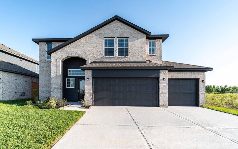 Front exterior of a new home in River Ranch Meadows, Dayton, TX, highlighting curb appeal (Image 1). Front exterior of a new home in River Ranch Meadows, Dayton, TX, highlighting curb appeal (Image 1).