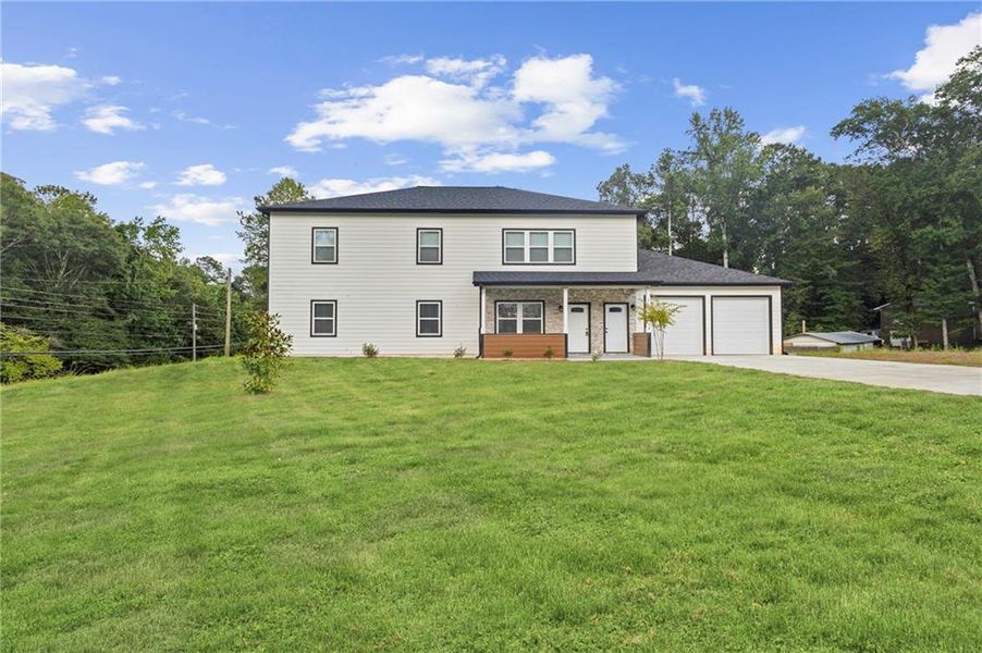 Front exterior of a new home in , Sugar Hill, GA, highlighting curb appeal (Image 2).