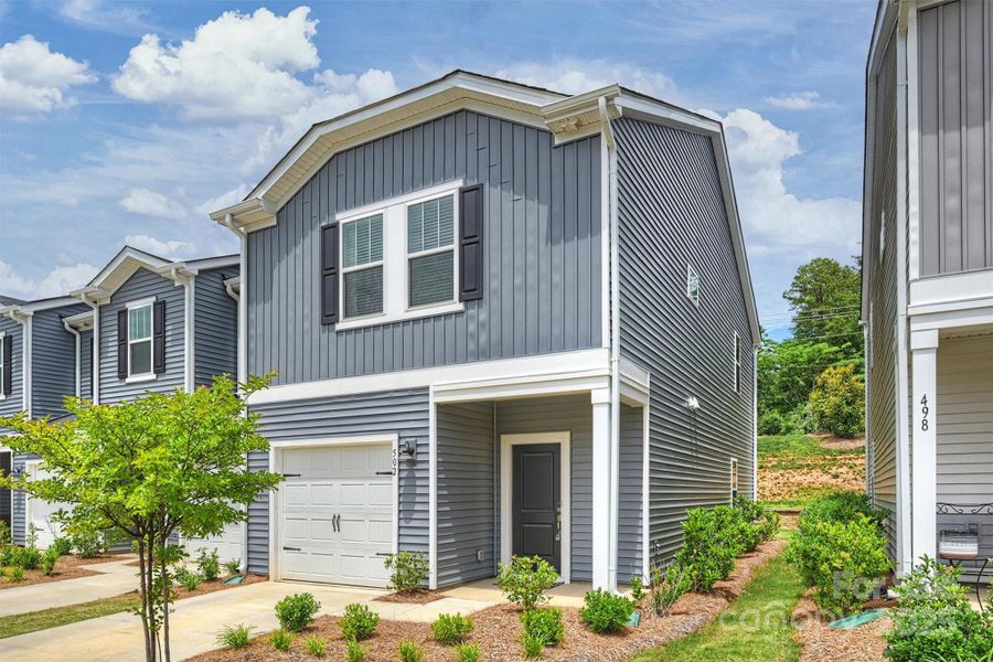 Front exterior of a new home in , Fort Mill, SC, highlighting curb appeal (Image 1). Front exterior of a new home in , Fort Mill, SC, highlighting curb appeal (Image 1).