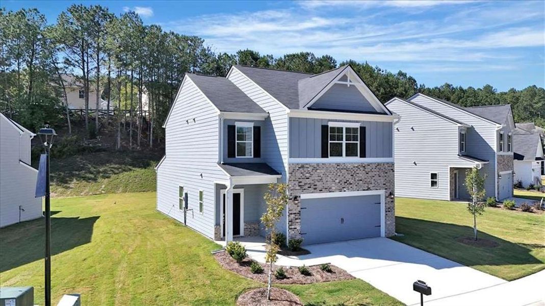 Front exterior of a new home in The View at Groover's Lake, Lithia Springs, GA, highlighting curb appeal (Image 2). Front exterior of a new home in The View at Groover's Lake, Lithia Springs, GA, highlighting curb appeal (Image 2).