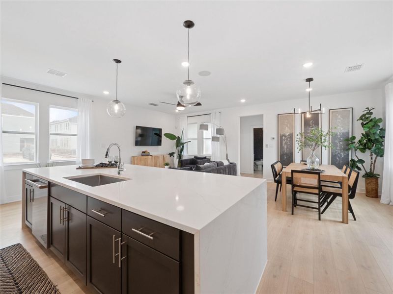Kitchen open to the dining area and great room (*Photo not of actual home and used for illustration purposes only.)