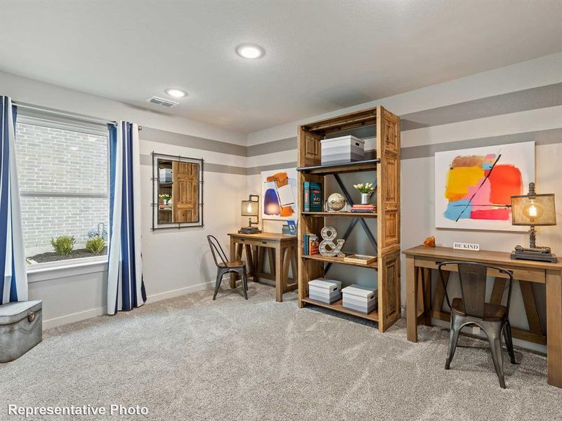 Office area featuring carpet floors and a wealth of natural light