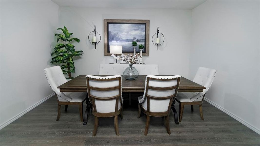 Dining room featuring dark wood-style floors