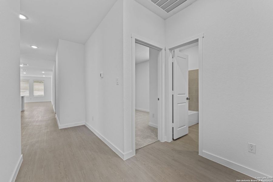 Spacious, unfurnished interior of a new home in Waterwheel: Coastline Collection, San Antonio (Image 20).