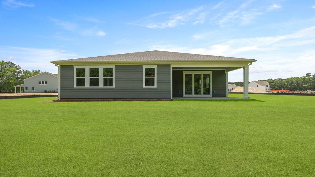 Front exterior of a new home in Berkeley Bay, Ridgeville, SC, highlighting curb appeal (Image 2).