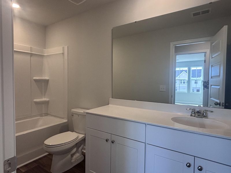 Furnished interior view inside a new home in Lindera Preserve at Cane Bay Plantation: Townhomes, Summerville (Image 5). Furnished interior view inside a new home in Lindera Preserve at Cane Bay Plantation: Townhomes, Summerville (Image 5).