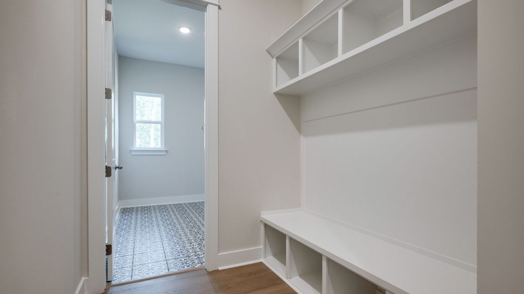 Convenient drop off space right next to dedicated laundry room