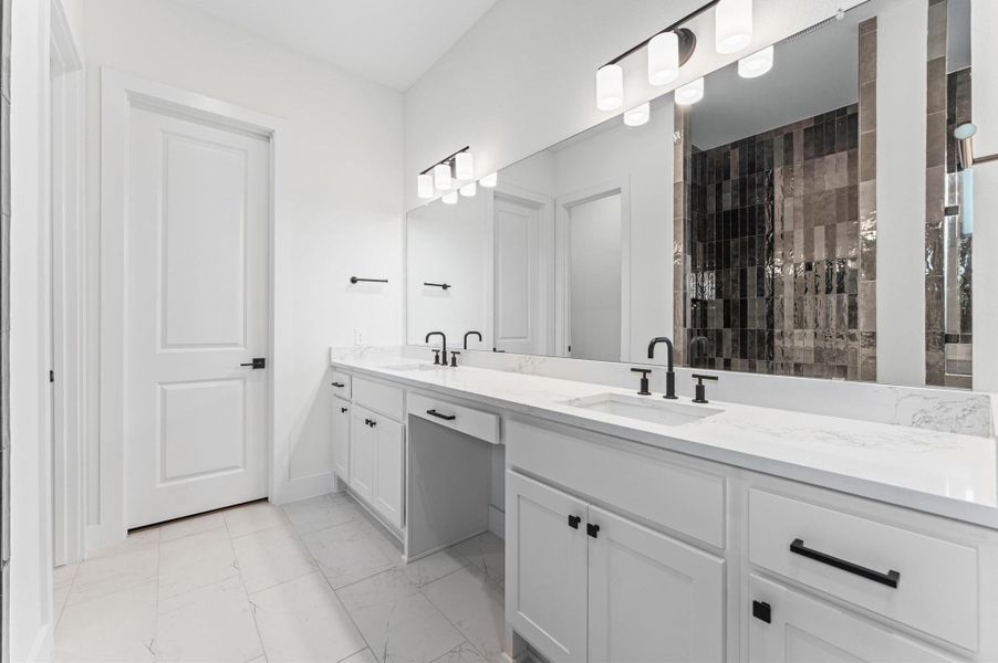 Thoughtfully appointed primary bath with upgraded shower.