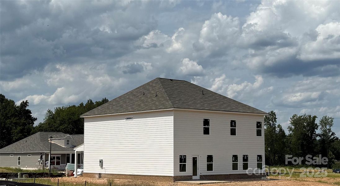 Front exterior of a new home in Cedar Meadows, Monroe, NC, highlighting curb appeal (Image 25). Front exterior of a new home in Cedar Meadows, Monroe, NC, highlighting curb appeal (Image 25).