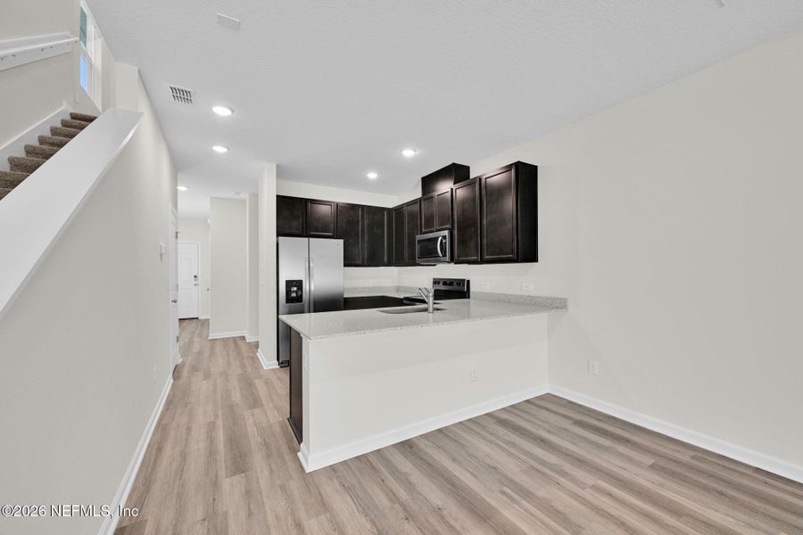 Furnished interior view inside a new home in Baxley Villas, Middleburg (Image 8).
