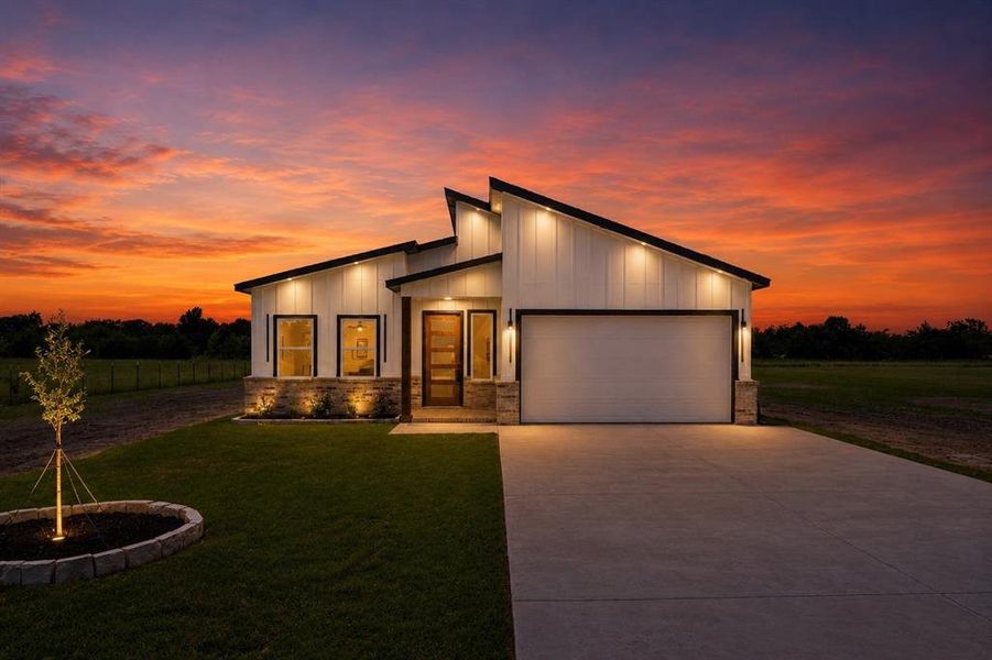 Front exterior of a new home in , Quinlan, TX, highlighting curb appeal (Image 24).
