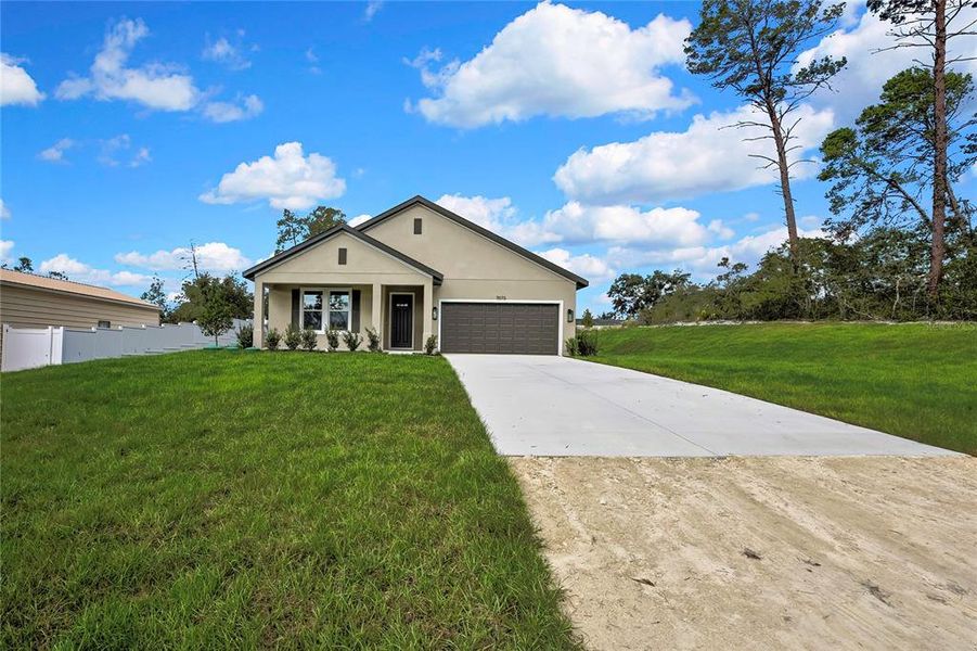 Front exterior of a new home in , Weeki Wachee, FL, highlighting curb appeal (Image 29). Front exterior of a new home in , Weeki Wachee, FL, highlighting curb appeal (Image 29).
