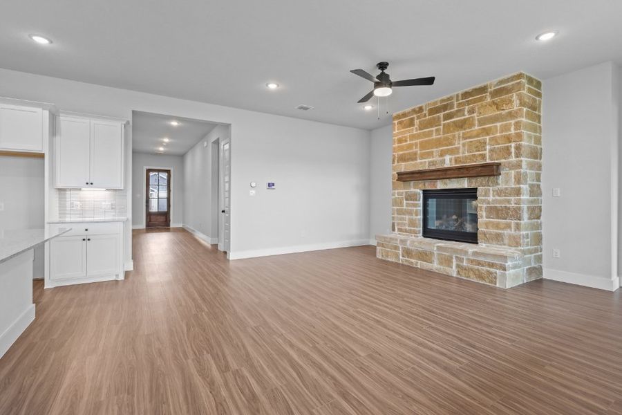 A large living room with a fireplace. A large living room with a fireplace.