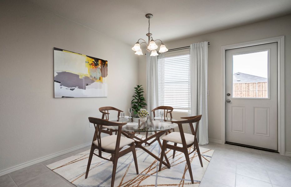 Dining area off kitchen with access to backyard Dining area off kitchen with access to backyard