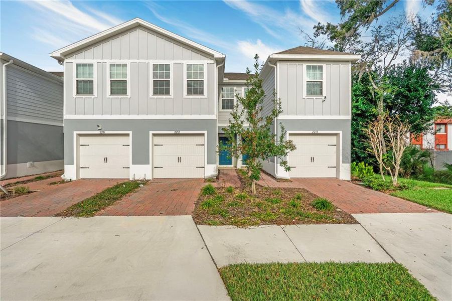 Front exterior of a new home in Edison Pointe, South Daytona, FL, highlighting curb appeal (Image 1). Front exterior of a new home in Edison Pointe, South Daytona, FL, highlighting curb appeal (Image 1).