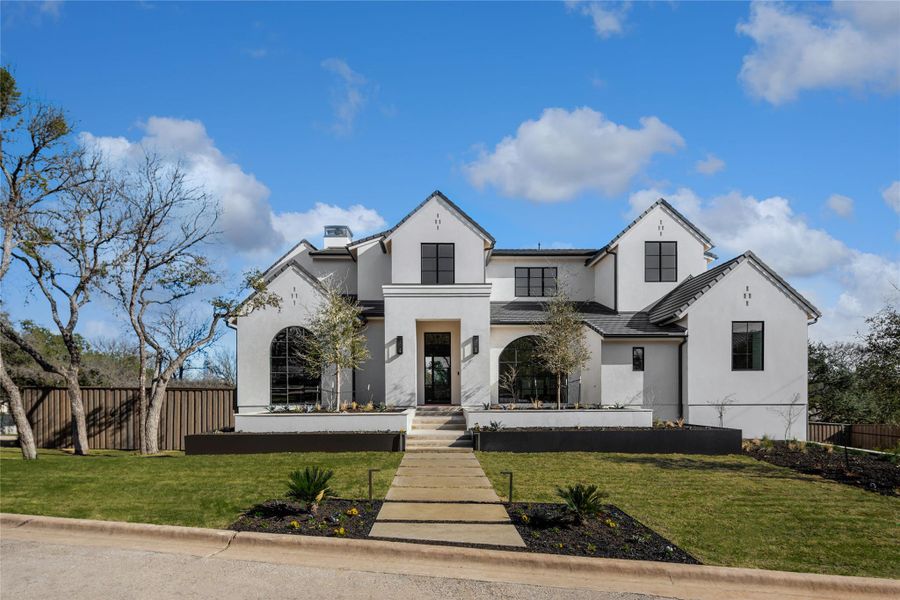 Front exterior of a new home in , Rollingwood, TX, highlighting curb appeal (Image 1). Front exterior of a new home in , Rollingwood, TX, highlighting curb appeal (Image 1).