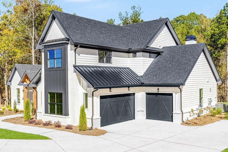 Front exterior of a new home in , Newnan, GA, highlighting curb appeal (Image 23). Front exterior of a new home in , Newnan, GA, highlighting curb appeal (Image 23).