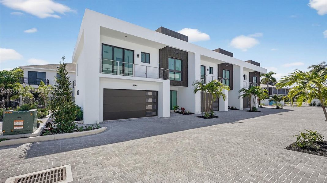 Front exterior of a new home in , Dania Beach, FL, highlighting curb appeal (Image 36).