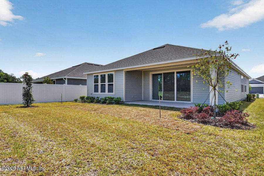 Exterior details and patio area of a home in Colbert Landings, Palm Coast (Image 3).