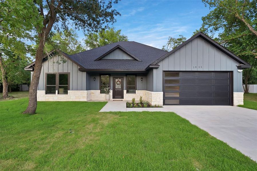 Front exterior of a new home in , Greenville, TX, highlighting curb appeal (Image 18). Front exterior of a new home in , Greenville, TX, highlighting curb appeal (Image 18).