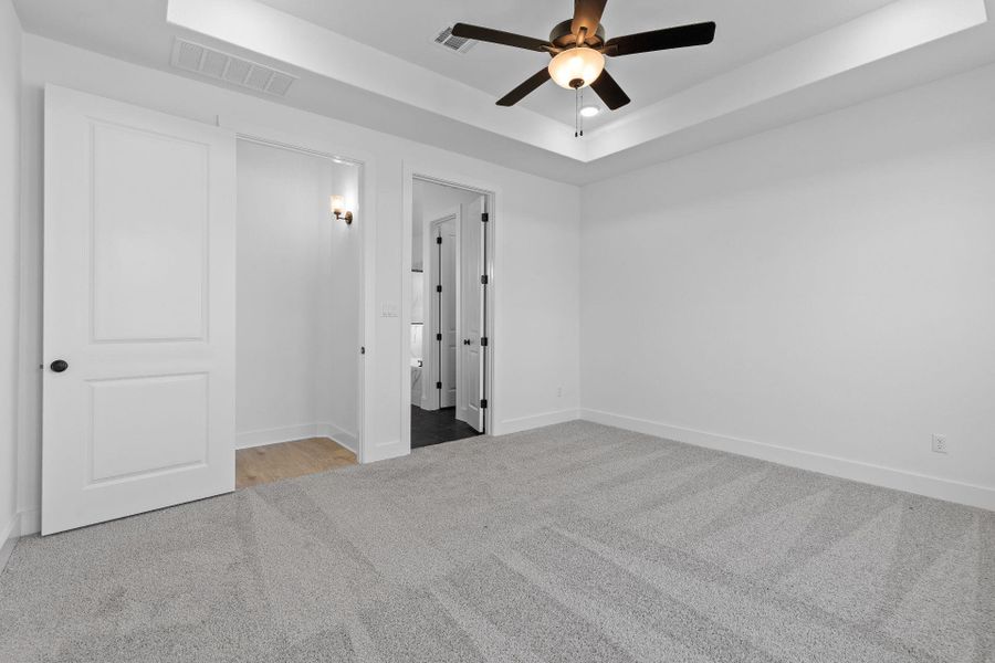 Primary Bedroom with tray ceiling Primary Bedroom with tray ceiling