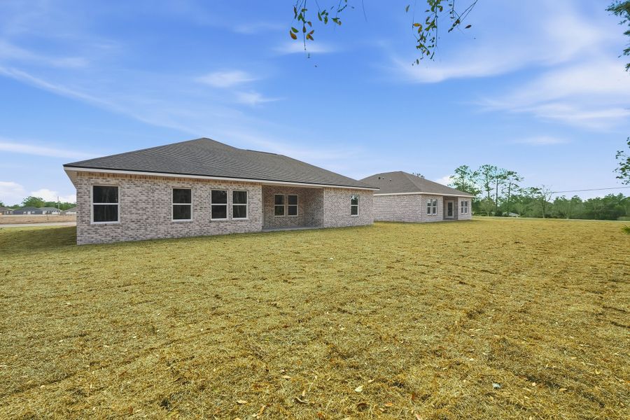 Exterior details and patio area of a home in Southern Charm, Crestview (Image 27).